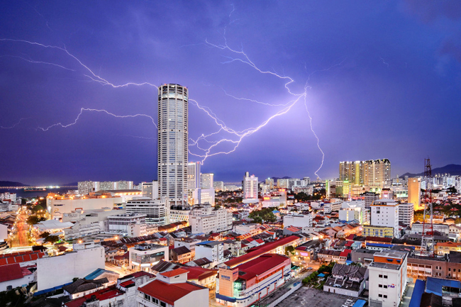 Lightning seemingly strikes Komtar Tower, the most iconic landmark of George Town, capital of Penang state in Malaysia. It is symbolic of the rejuvenation that the city, famous for a unique blend of centuries-old buildings and modern structures, has enjoyed in recent years. While many of its old neighbourhoods fell into neglect in the 1990s and early 2000s, UNESCO World Heritage listing in 2008 sparked a transformation, and today, they are all part of a vibrant tourist destination. 2016 National Geographic Travel Photographer of the Year WINNERS