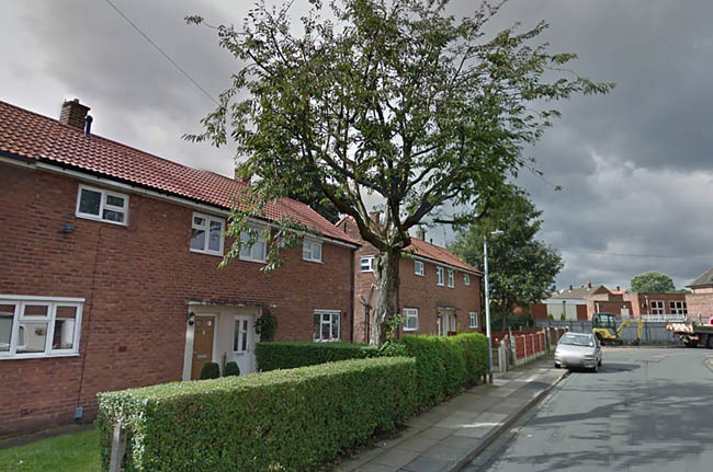 PIC BY GOOGLE MAPS/MERCURY PRESS (PICTURED: THE TREE IN MARGARET HARRIS FRONT GARDEN IN SALFORD, GREATER MANCHESTER BEFORE BEING HACKED DOWN) A distraught mum claims years of family memories were crushed when she returned home to find a tree that had adorned the garden of her family home for three generations had been hacked down. Carly Yates, 29, was left in tears when she returned from holiday to discover a mere ugly stump remaining of the beautiful tree that had graced their family's front garden in Salford, Greater Manchester. The mum-of-one has lived in the property since 2012 but the beautiful flower bed, allegedly trampled during the chop, was still tended by her gran Margaret Harris who lived there since 1990. The fuming childminder claims that the housing agency not only chopped the tree down without informing the family but left them to pay the 440 clean-up bill too. SEE MERCURY COPY
