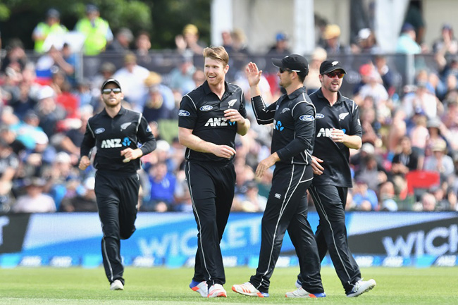 CHRISTCHURCH, NEW ZEALAND - DECEMBER 26:  James Neesham of New Zealand is congratulated by team mates after dismissing Mahmudullah of Bangladesh during the first One Day International match between New Zealand and Bangladesh at Hagley Oval on December 26, 2016 in Christchurch, New Zealand.  (Photo by Kai Schwoerer/Getty Images)