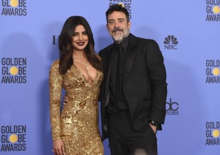 Priyanka Chopra, left, and Jeffrey Dean Morgan pose in the press room at the 74th annual Golden Globe Awards at the Beverly Hilton Hotel on Sunday, Jan. 8, 2017, in Beverly Hills, Calif. (Photo by Jordan Strauss/Invision/AP)