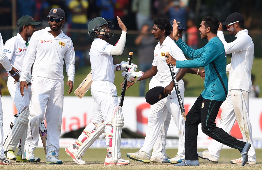 Bangladesh captain Mushfiqur Rahim (C) and teammates celebrate their victory over Sri Lanka by four wickets on the fifth and final day of the second and final Test cricket match between Sri Lanka and Bangladesh at The P. Sara Oval Cricket Stadium in Colombo on March 19, 2017. / AFP PHOTO / Ishara S. KODIKARA (Photo credit should read ISHARA S. KODIKARA/AFP/Getty Images)